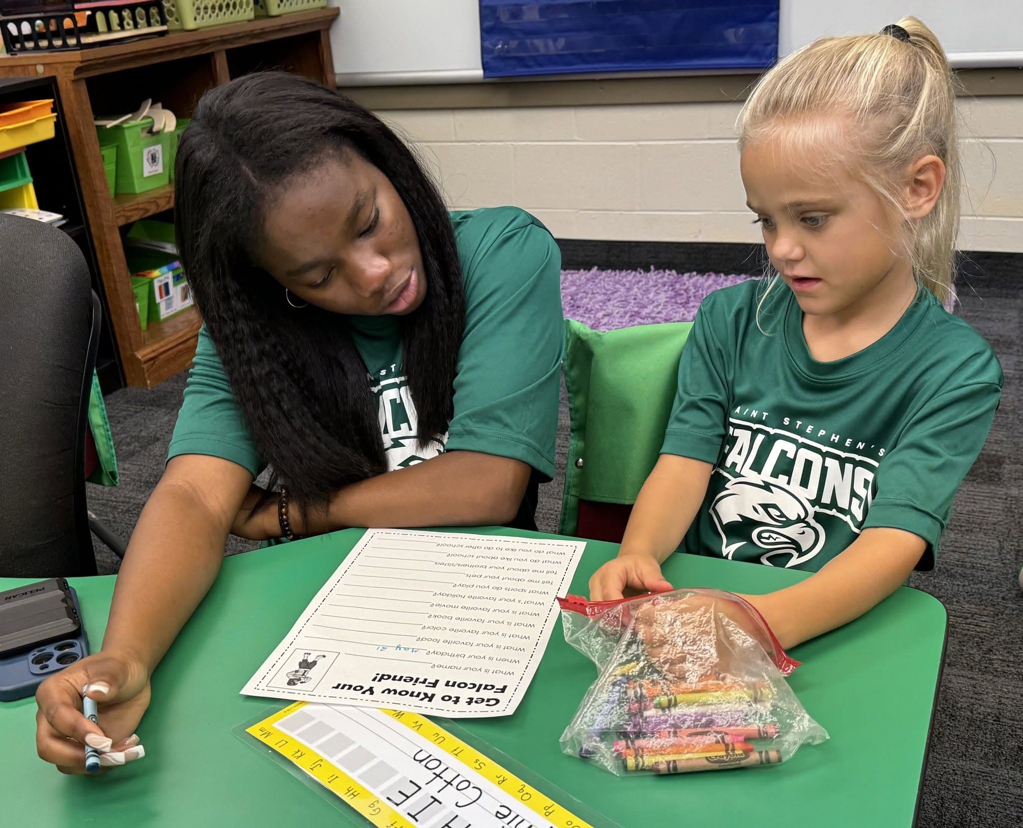 A Lower School student with her Falcon Friend