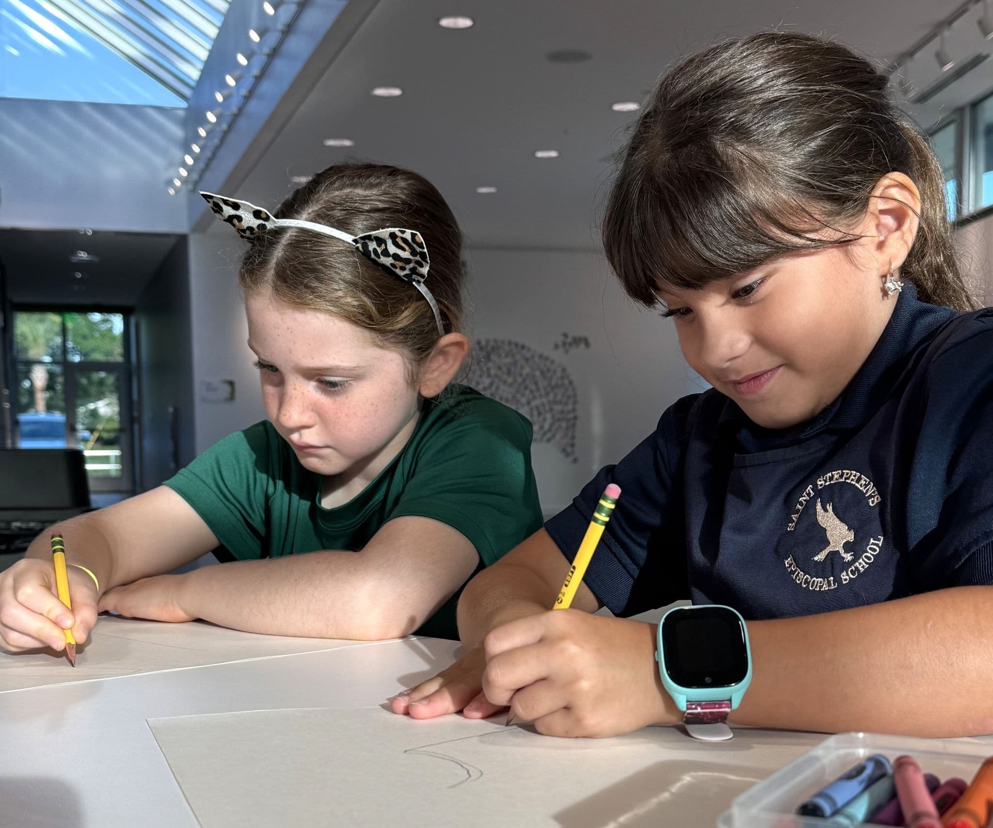 A Saint Stephen's students work on a project in the Pullen Center.