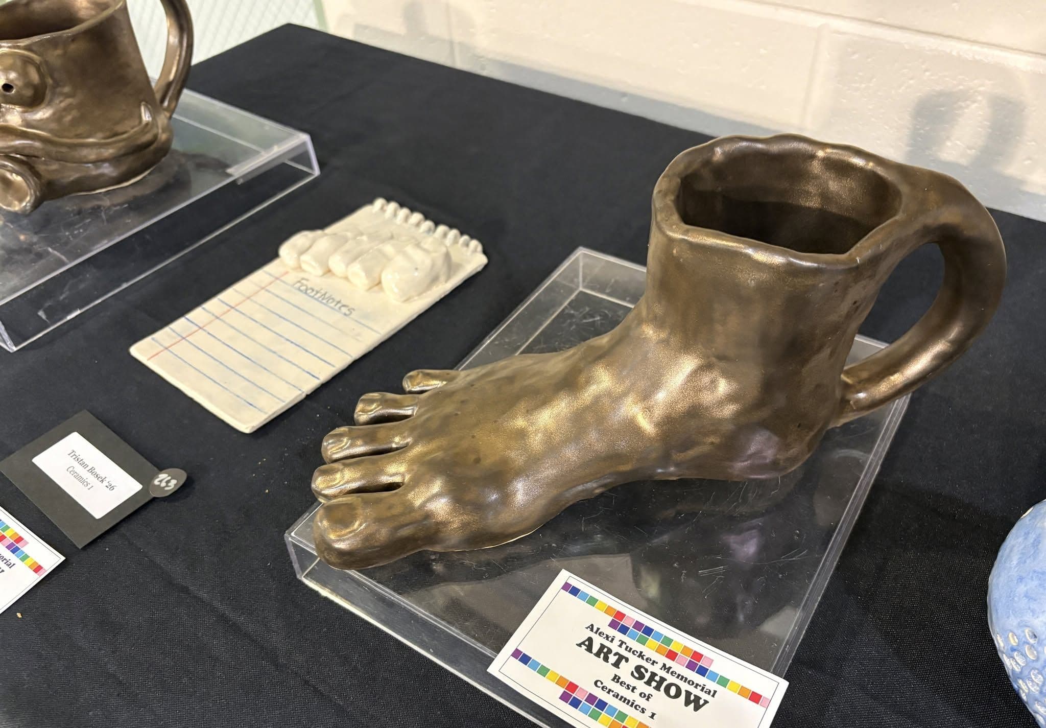 art sculpture of foot as a mug