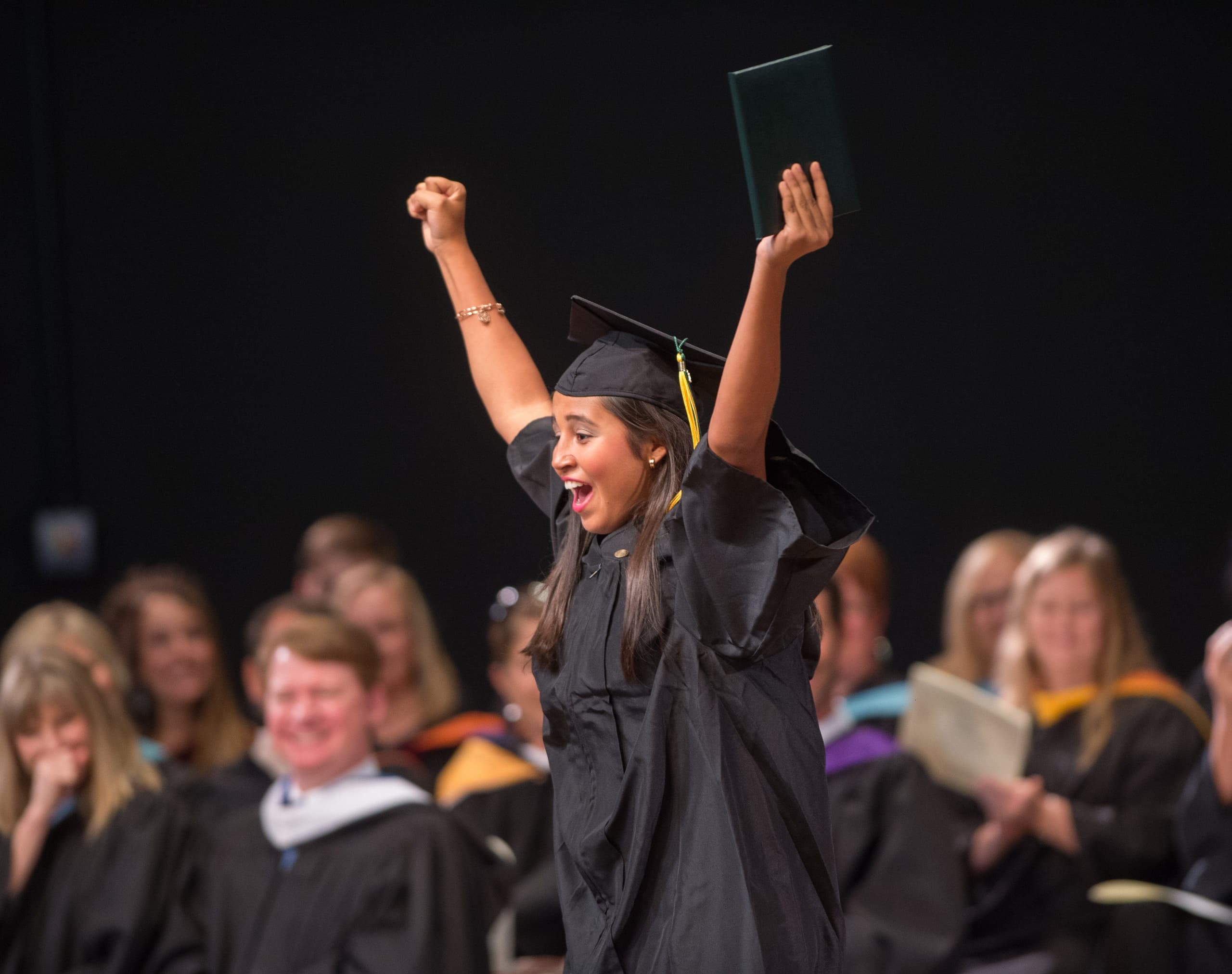 A graduate celebrates