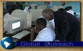 Global Outreach logo over image of person helping an student in Tanzania