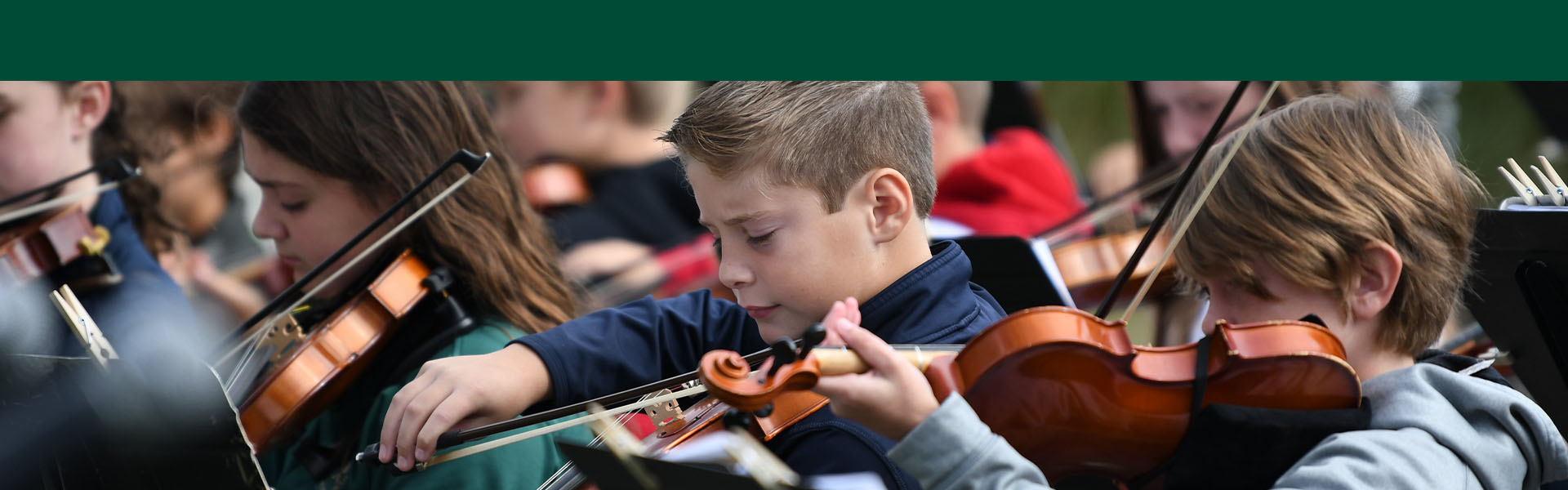 Students playing violins