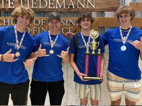 Saint Stephen's students holding trophy