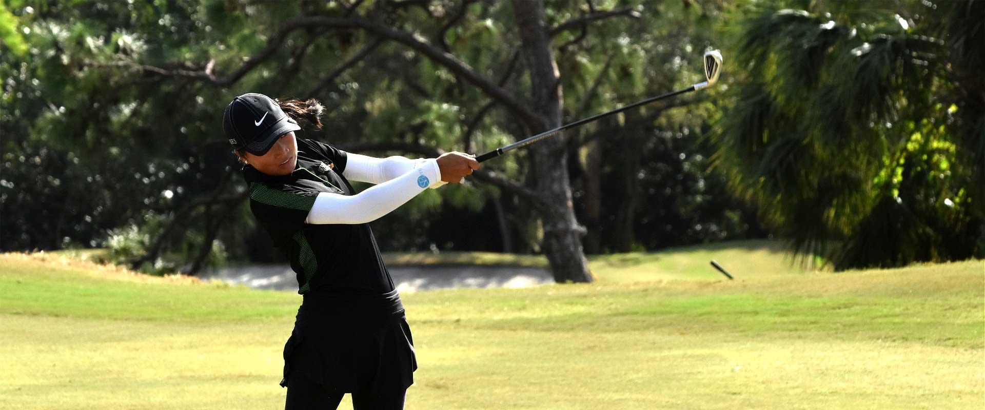 Student playing golf