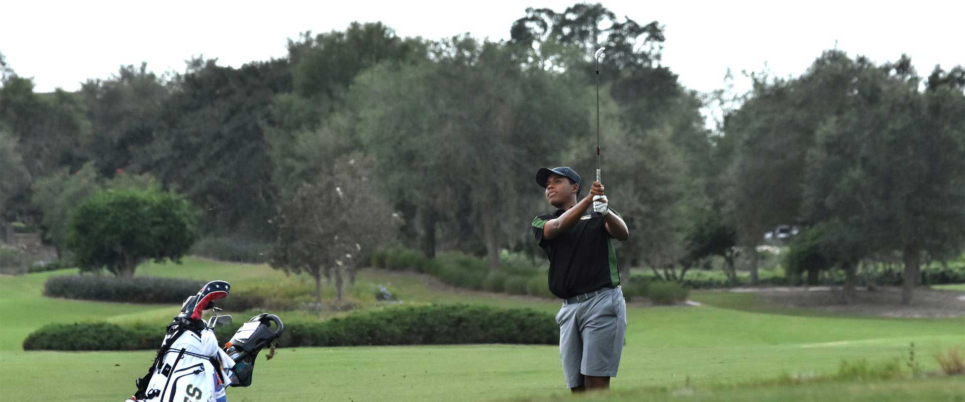 Student playing golf