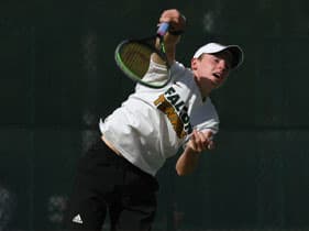 Student playing tennis